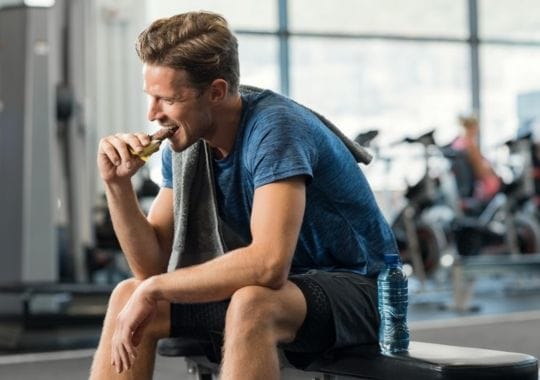 A man eating protein cookies.