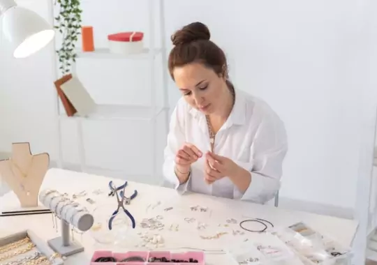 A woman making bead bracelets.