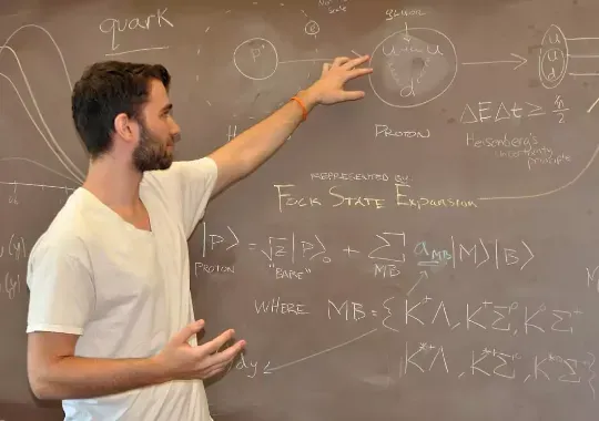 A man solving physics questions.
