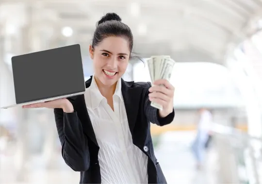 A holding a laptop and money.